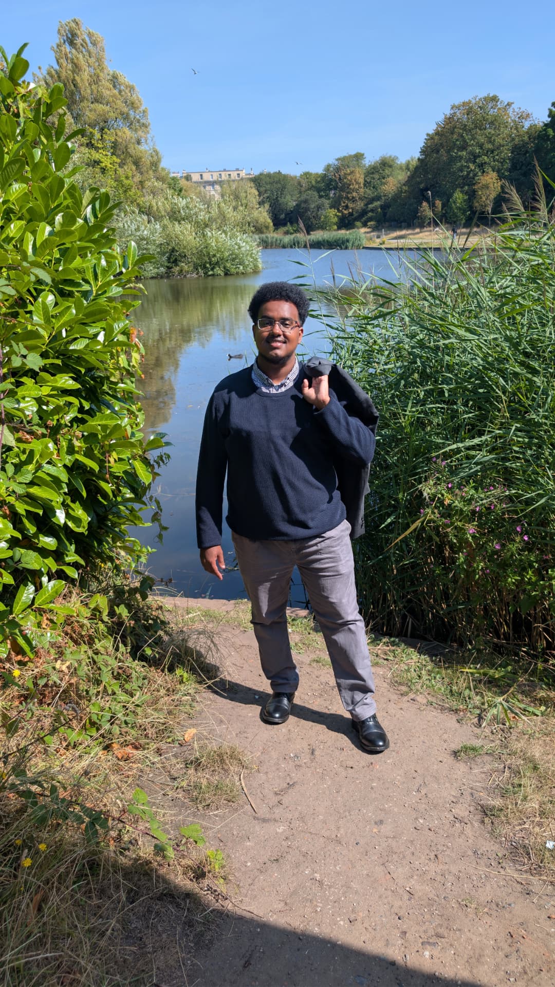 Abdi Ahmed by the lake in Princes Park, L8